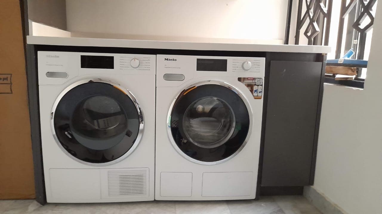Neat laundry stacked washer and dryer setup